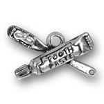 Silver toothbrush and toothpaste charm